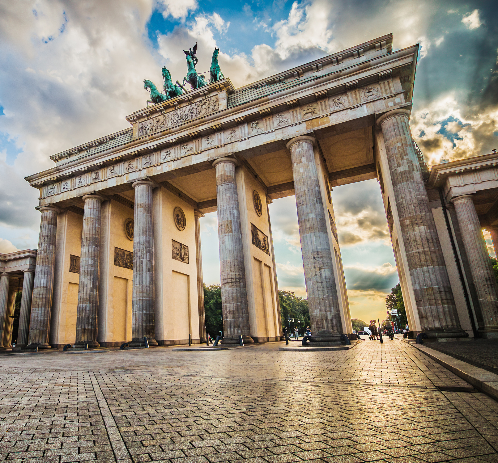 Brandenburg Gate with Quadriga, photographed from below, at sunset.